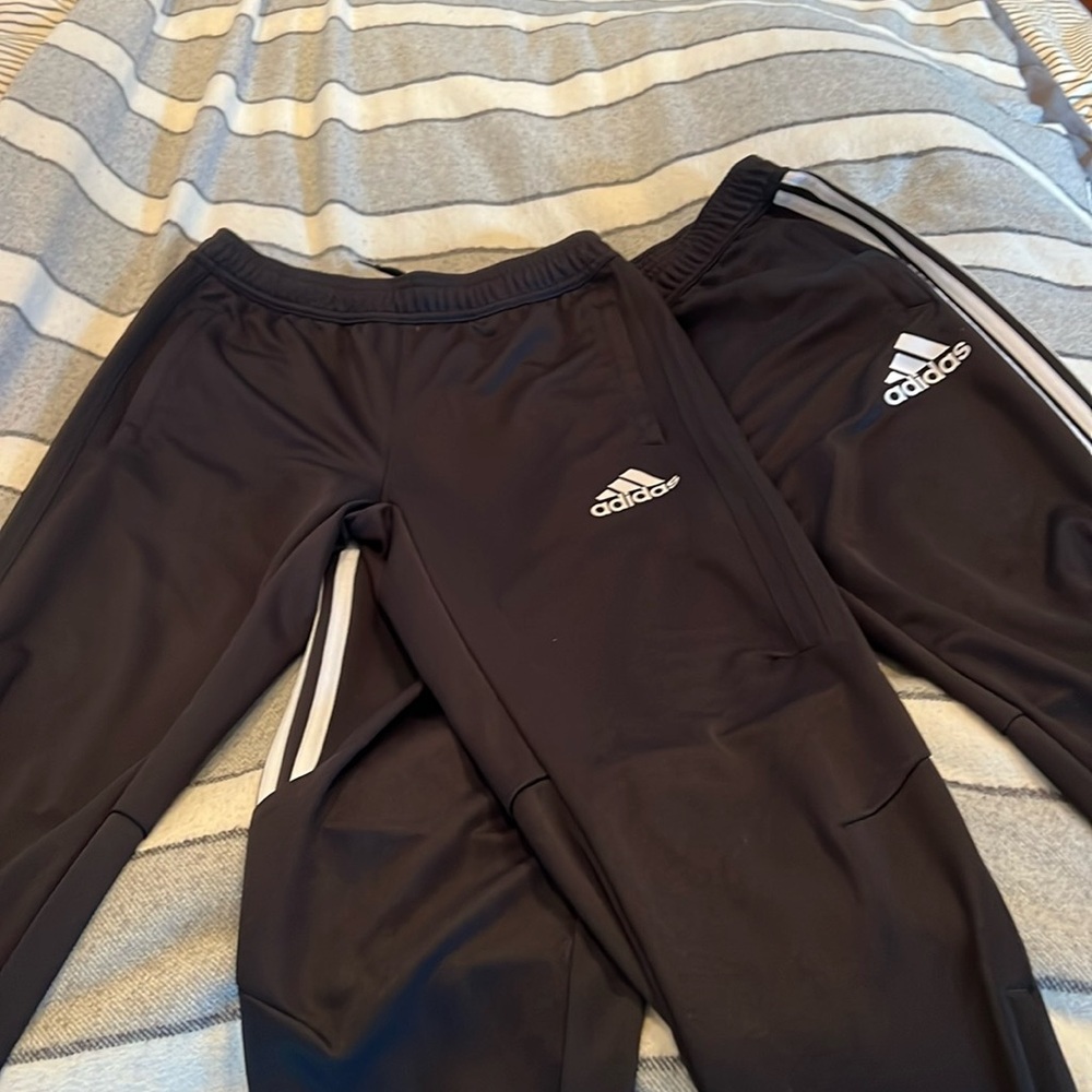 Boys adidas track pants. one black with white stripes and one black with black